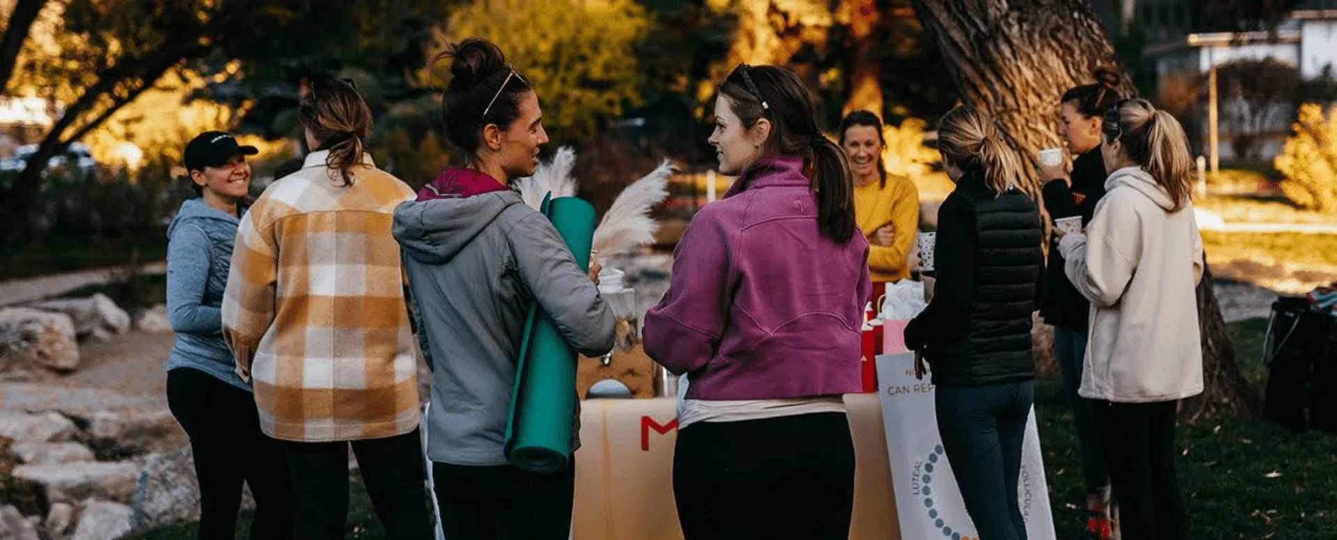 a group of women at a stall at the Women’s Health and Wellbeing Expo