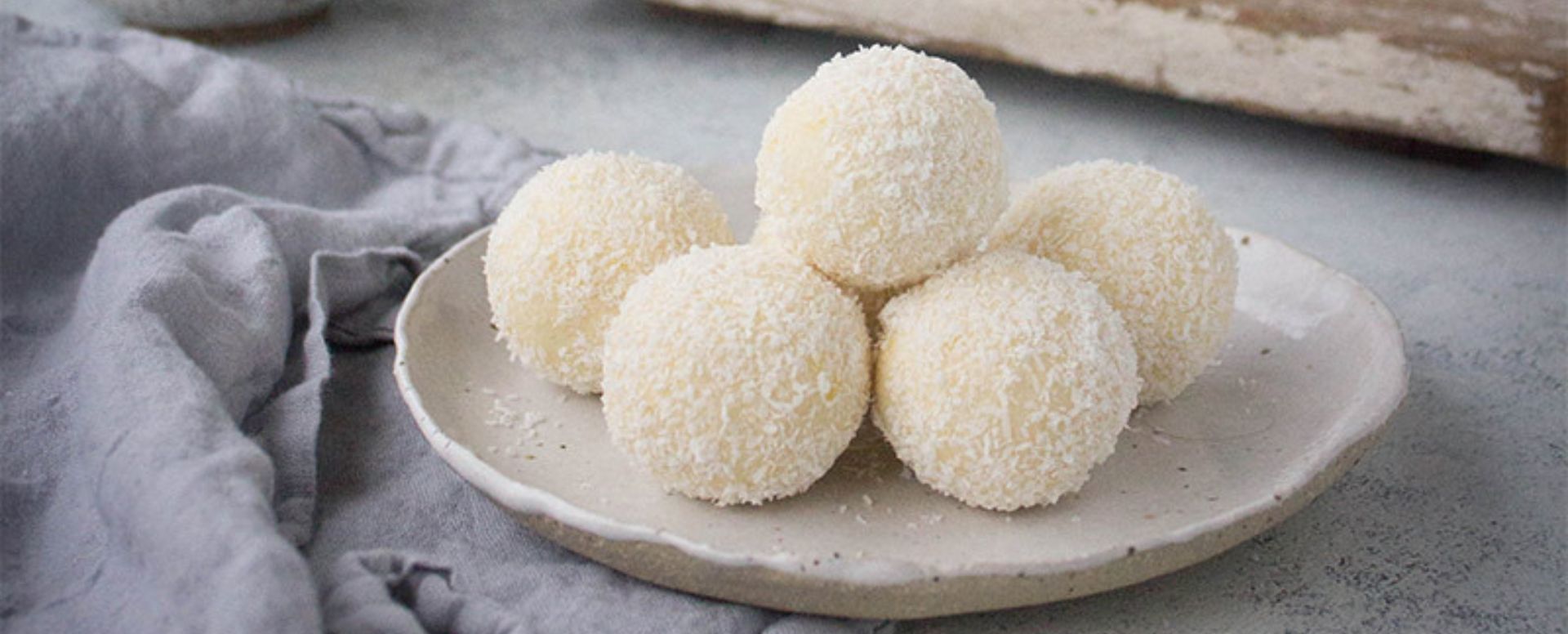 Lemon cheesecake bliss balls on plate