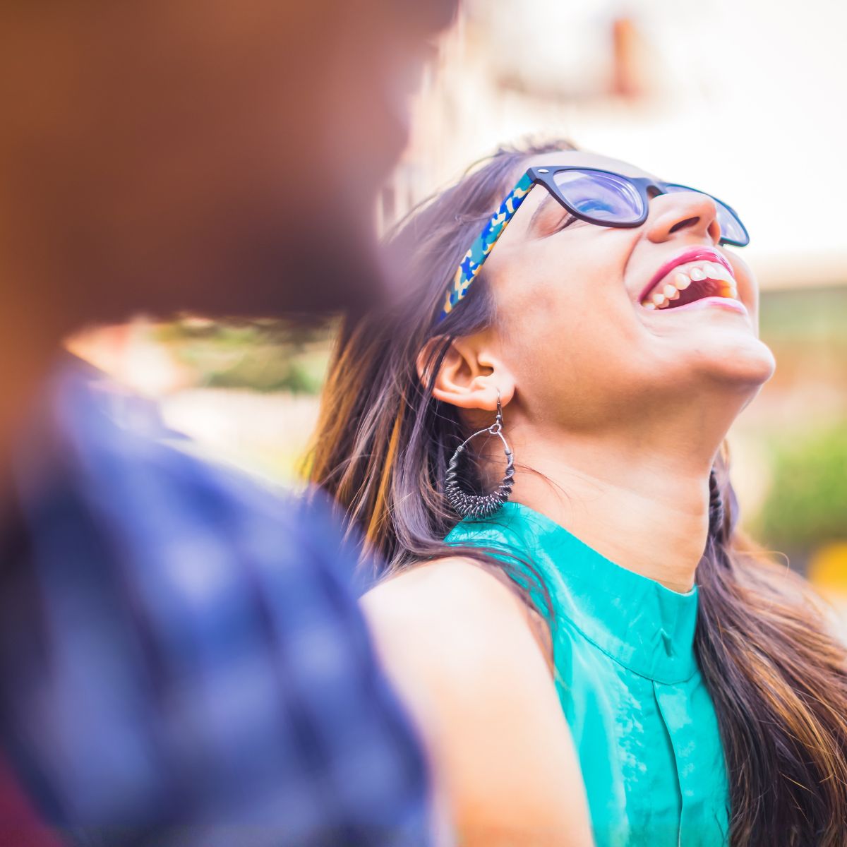 women with glasses laughing